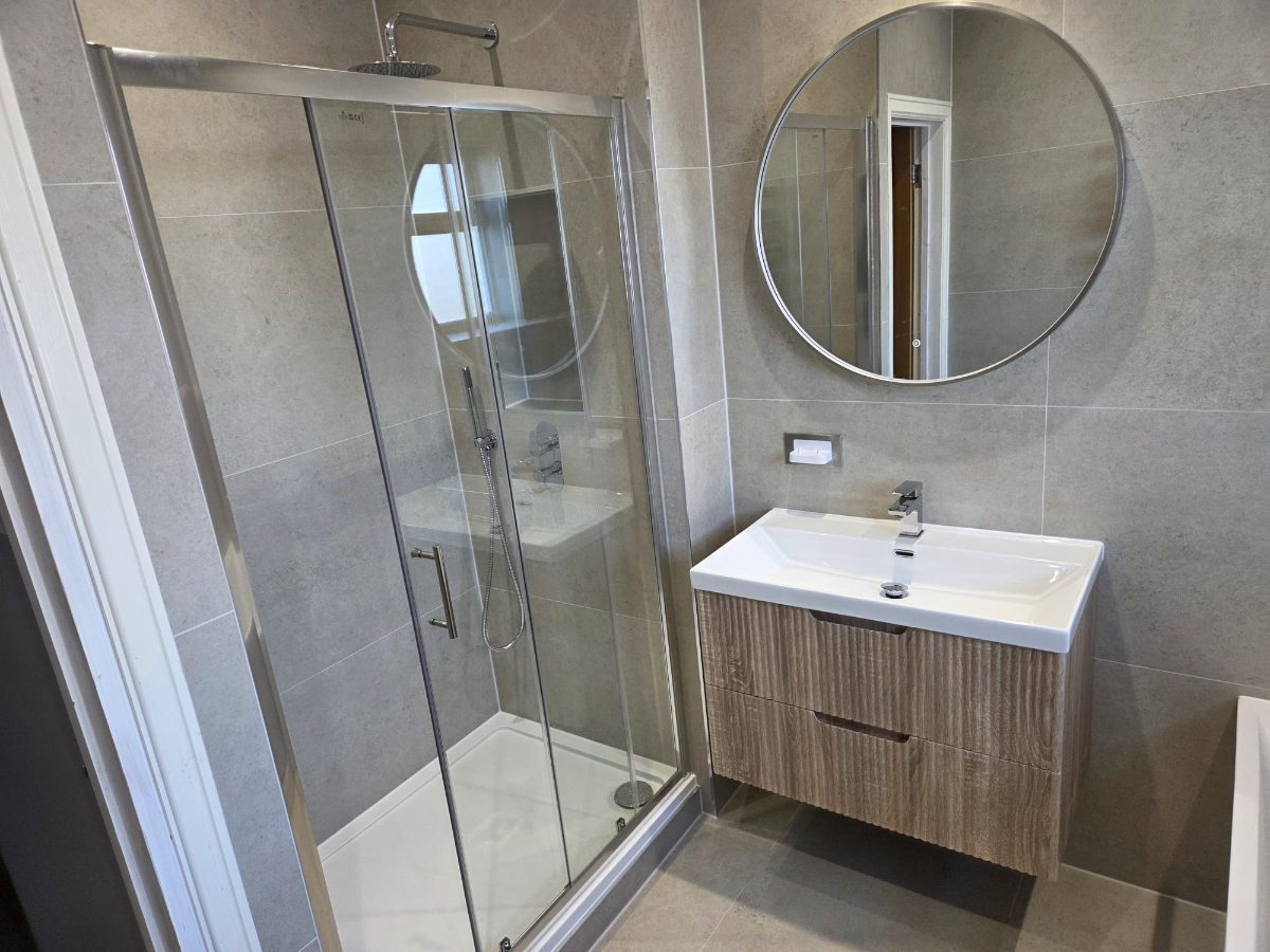 Fully tiled bathroom with walk-in shower